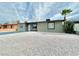 Charming front exterior with gravel yard and desert landscaping at 604 N Minnesota St, Las Vegas, NV 89107