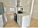 Modern kitchen with stainless steel appliances, white cabinets, and quartz countertops at 604 N Minnesota St, Las Vegas, NV 89107