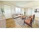 Bright living room with neutral tones, modern furniture, and wood-style flooring at 604 N Minnesota St, Las Vegas, NV 89107