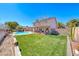Wide shot of the expansive backyard, pool, and patio area, perfect for outdoor living at 637 Del Prado Dr, Boulder City, NV 89005