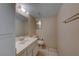 Cozy bathroom with functional sink, toilet, and mirror at 637 Del Prado Dr, Boulder City, NV 89005