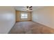 Spacious carpeted bedroom features a ceiling fan and window at 637 Del Prado Dr, Boulder City, NV 89005