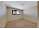 Bright bedroom features neutral walls, plush carpet, and a window with wood-toned blinds at 637 Del Prado Dr, Boulder City, NV 89005