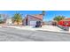 Attractive single-Gathering house with a desert landscape featuring an ample driveway and attached garage at 637 Del Prado Dr, Boulder City, NV 89005