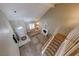 Bright living room featuring vaulted ceilings, a cozy fireplace, and a staircase leading to the second floor at 637 Del Prado Dr, Boulder City, NV 89005