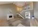 Open living area with a fireplace, staircase, and views into other rooms, creating a seamless living space at 637 Del Prado Dr, Boulder City, NV 89005