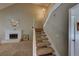 Comfortable living room area with fireplace and staircase at 637 Del Prado Dr, Boulder City, NV 89005
