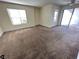 A spacious bedroom with a ceiling fan, a large window, and sliding glass door access to a balcony at 6800 E Lake Mead Blvd # 2011, Las Vegas, NV 89156