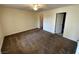 Comfortable bedroom featuring neutral paint, carpeted floors, and a ceiling fan at 6800 E Lake Mead Blvd # 2011, Las Vegas, NV 89156