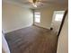 Cozy bedroom featuring neutral paint, carpeted floors, a window, and a ceiling fan at 6800 E Lake Mead Blvd # 2011, Las Vegas, NV 89156