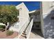 A two-story home featuring an inviting staircase leading up to the entrance and lovely curb appeal at 6800 E Lake Mead Blvd # 2011, Las Vegas, NV 89156