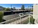 An above ground view of the community parking lot with carports and various cars parked in their designated spaces at 6800 E Lake Mead Blvd # 2011, Las Vegas, NV 89156