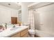 Bright bathroom with a single sink vanity, shower/tub combo, and neutral color scheme at 6809 Cobre Azul # 201, Las Vegas, NV 89108