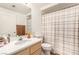 Bright bathroom featuring a single sink vanity, shower/tub combo, and neutral colors at 6809 Cobre Azul # 201, Las Vegas, NV 89108