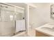 Bathroom featuring a glass enclosed shower, a double vanity, and bright lighting at 6809 Cobre Azul # 201, Las Vegas, NV 89108