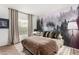 Bedroom with large mural feature wall and view to backyard at 6809 Cobre Azul # 201, Las Vegas, NV 89108