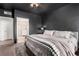 Spacious bedroom with black walls and ensuite bathroom at 6809 Cobre Azul # 201, Las Vegas, NV 89108