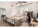 Bright bedroom with a ceiling fan, cozy rug, and a small desk area for working at 6809 Cobre Azul # 201, Las Vegas, NV 89108