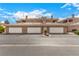 Townhome building with multiple two car garages and desert landscaping at 6809 Cobre Azul # 201, Las Vegas, NV 89108