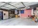 Spacious two car garage with fridge, shelving, and gray epoxy flooring at 6809 Cobre Azul # 201, Las Vegas, NV 89108