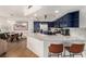 Open kitchen featuring stainless steel appliances, a breakfast bar, and modern countertops at 6809 Cobre Azul # 201, Las Vegas, NV 89108