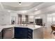 Kitchen featuring stainless steel appliances and quartz countertops, with an open view to the living room at 6809 Cobre Azul # 201, Las Vegas, NV 89108