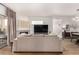 Cozy living room seamlessly connects to dining and outdoor spaces with a stone fireplace at 6809 Cobre Azul # 201, Las Vegas, NV 89108
