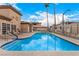 Community pool with lounge chairs and manicured landscaping at 6809 Cobre Azul # 201, Las Vegas, NV 89108