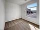 Bright bedroom featuring carpet flooring and ample natural light from the large window at 7024 Whispering Falls Dr, North Las Vegas, NV 89084