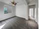 Spacious bedroom featuring carpeted flooring, a ceiling fan, and ample natural light at 7024 Whispering Falls Dr, North Las Vegas, NV 89084