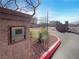 A secure entry gate with key pad and desert landscaping offers peace of mind for residents at 7024 Whispering Falls Dr, North Las Vegas, NV 89084