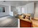 Stylish kitchen featuring granite countertops, stainless steel sink, and an open view to the living spaces at 7024 Whispering Falls Dr, North Las Vegas, NV 89084