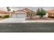 Charming single-story home featuring a two-car garage and a well-maintained front yard at 7413 Turtle Dove Ct, Las Vegas, NV 89129