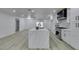 Modern kitchen featuring a large island with white countertops and stainless steel appliances at 7413 Turtle Dove Ct, Las Vegas, NV 89129