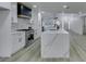 Bright, modern kitchen featuring an island, white cabinets, and stainless steel appliances at 7413 Turtle Dove Ct, Las Vegas, NV 89129