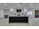 Modern open kitchen with a large island, sleek countertops, and contemporary design at 7413 Turtle Dove Ct, Las Vegas, NV 89129