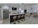 Modern kitchen with stainless steel appliances, a large island with seating, and an open floor plan at 7413 Turtle Dove Ct, Las Vegas, NV 89129