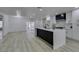 Bright, spacious kitchen featuring a large island with an open floor plan and modern finishes at 7413 Turtle Dove Ct, Las Vegas, NV 89129