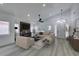 Bright living room with modern fireplace, ceiling fan, and ample natural light at 7413 Turtle Dove Ct, Las Vegas, NV 89129