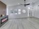 Bright, airy living room featuring gray flooring and an electric fireplace feature at 7413 Turtle Dove Ct, Las Vegas, NV 89129