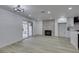 An open living room featuring sliding glass doors, a fireplace, and modern cabinetry at 7413 Turtle Dove Ct, Las Vegas, NV 89129