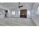 Living room view highlighting the fireplace and abundant natural light at 7413 Turtle Dove Ct, Las Vegas, NV 89129