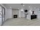 Cozy living room with fireplace and access to the patio at 7413 Turtle Dove Ct, Las Vegas, NV 89129