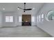 Living room with fireplace and large windows providing ample light at 7413 Turtle Dove Ct, Las Vegas, NV 89129