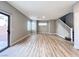 Spacious living room features wood flooring and access to the backyard at 7696 Mocorito Ave, Las Vegas, NV 89113