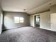 Spacious main bedroom features neutral carpet and entry to the ensuite bathroom at 7696 Mocorito Ave, Las Vegas, NV 89113
