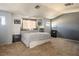 Large bedroom with a full bed, neutral walls, and carpeted floors offer comfort at 7820 Esteem St, Las Vegas, NV 89131