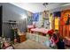 Whimsical bedroom with anime decor, a bed, side table, and unique decorative touches at 7820 Esteem St, Las Vegas, NV 89131