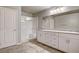 Bright bathroom featuring double vanity, granite countertop, walk-in shower, and tile flooring at 7828 Stone Forest St, North Las Vegas, NV 89084