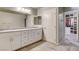 Bright bathroom featuring a double vanity with granite countertop and an open walk-in closet at 7828 Stone Forest St, North Las Vegas, NV 89084